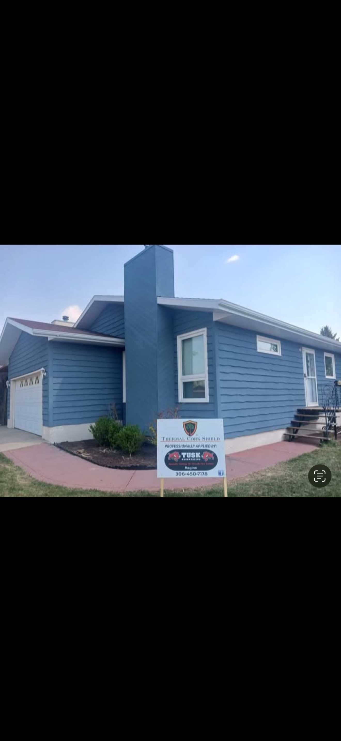 After: the same home with blue cork coating and white trim