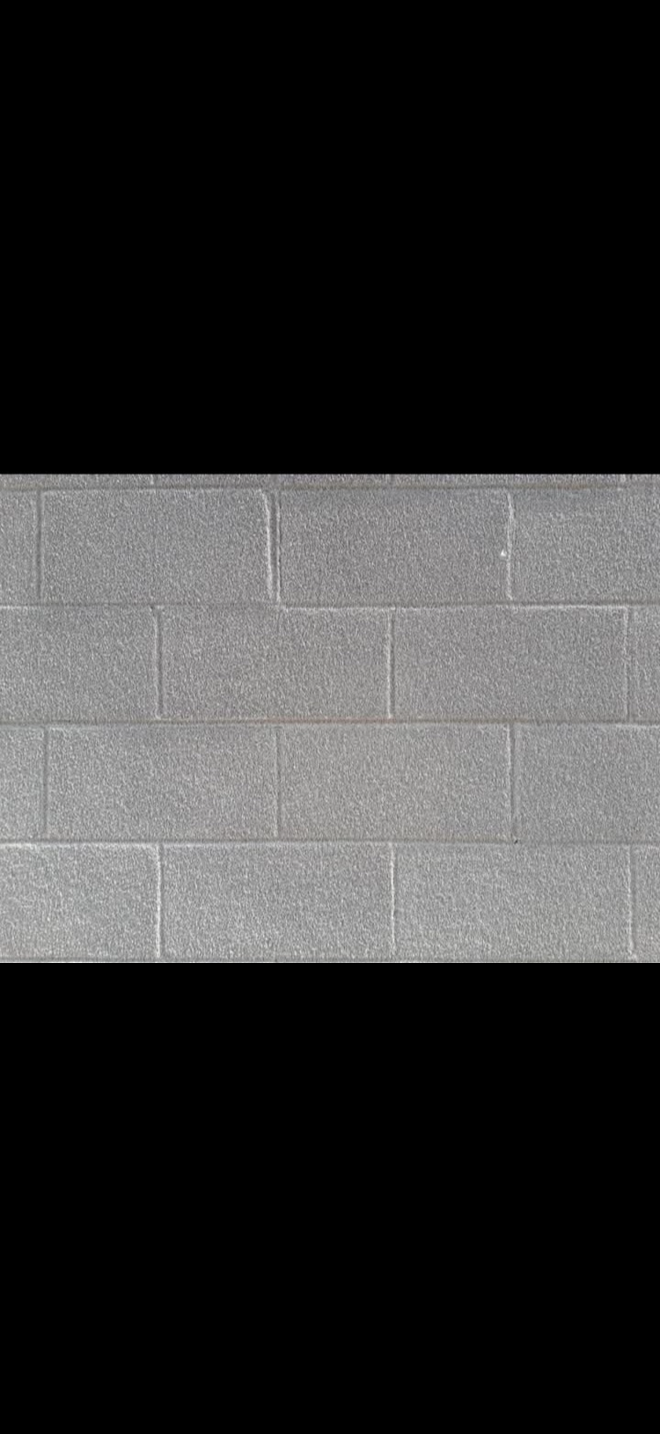 Textured coating applied to masonry blocks